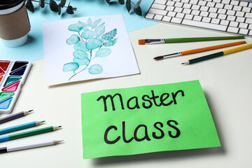 Master class in painting. Drawing of plants, supplies and computer keyboard on color table