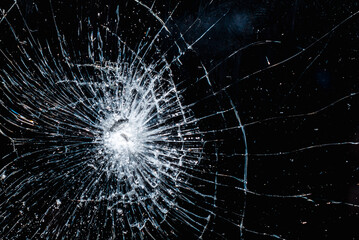 Broken glass texture on black background. Abstract of cracked screen smartphone from shock.