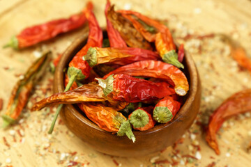Dry organic red round chillies top view background. Healthy spices, selective focus