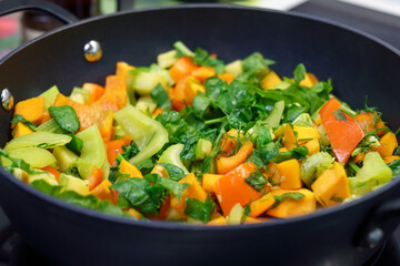 Vegetables Domestic kitchen cooking. Chopped fresh vegetables. Carrot, celery, red peppers.