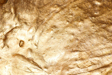 the texture of a golden stone. golden streaks. backgrounds and textures