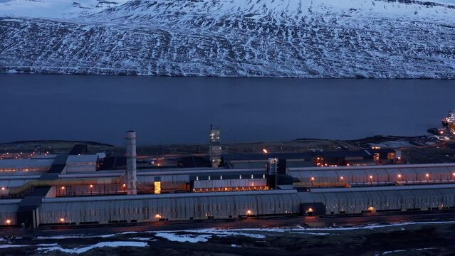 Aluminium smelter factory at night time in Rey&eth;arfj&ouml;r&eth;ur fjord, aerial