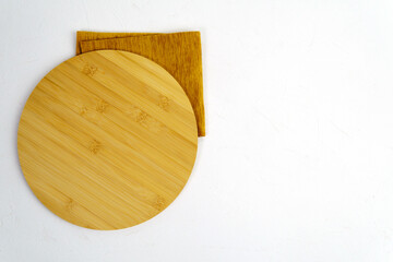 Round cutting board. Top view, flat lay, copy space, white background.