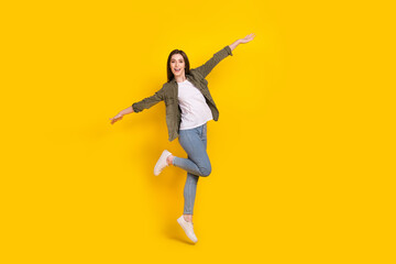 Fototapeta na wymiar Full body photo of cheerful lady tourist have fun during summer travel around the world isolated on yellow color background