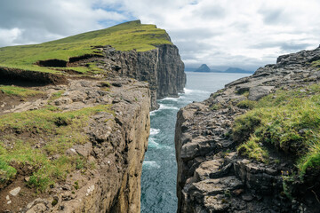 Incredible view of Sorvagsvatn or Leitisvatn is the largest lake in the Faroe Islands. It is situated on the island of Vagar between the municipalities of Sorvagur and Vagar.  Beauty of nature concept
