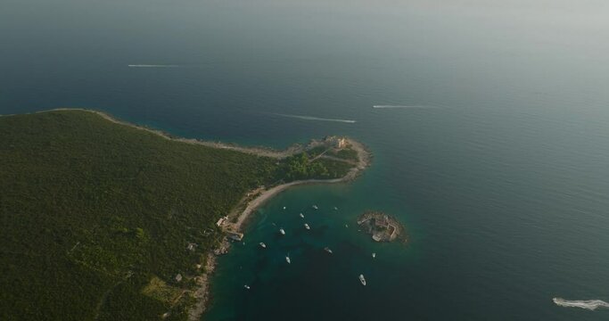 floating boats and yachts with Otocic Gospa island and fortress arza on background