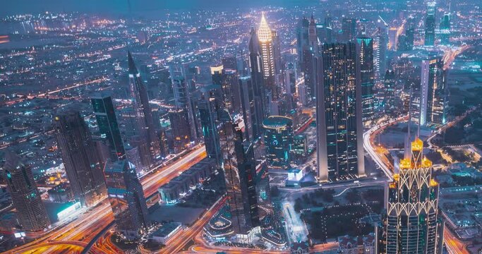 Dubai, Uae, United Arab Emirates. 4k Hyperlapse View Form Viewpoint On Burj Khalifa. Lights Line Illumination. Evening To Night Transition. City Traffic Under Khalifa Tower. Night City Life. Gradual