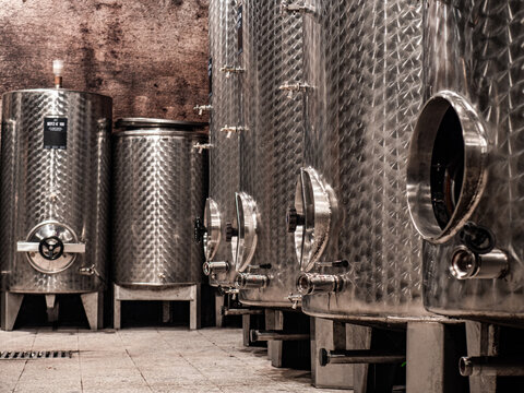 Stainless wine barrels in old vineyard cellar