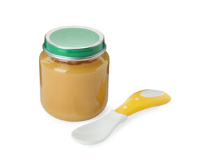 Jar of healthy baby food and spoon on white background