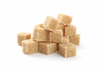 Pile of cubes with brown sugar on white background