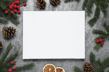 Blank canvas and Christmas decor on grey table, flat lay. Space for design