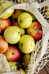 Apples. Apples in the bag on the wooden table