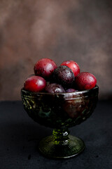 plums on a dark background