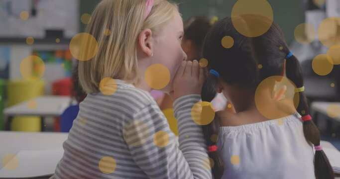 Animation of yellow spots over diverse school children in classroom