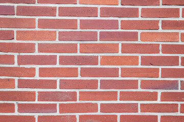 wall with red small bricks, background for a screensaver with a place for an inscription