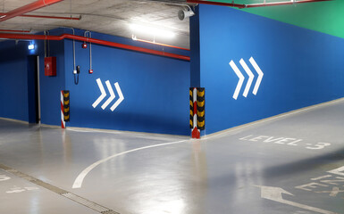 Underground garage parking new modern. Public space for cars. A subterranean parking lot interior.