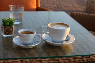 On the table in the restaurant strong and hot coffee.