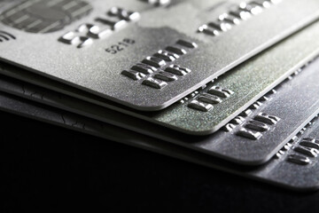 Close-up of a group of bank credit cards on dark background