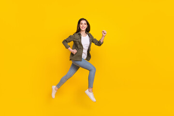 Fototapeta na wymiar Full size profile side photo of overjoyed energetic shopaholic girl run shopping isolated on yellow color background