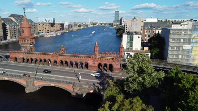 Famous club Watergate Berlin on river. Perfect aerial view flight pedestal up drone footage of Oberbaumbrücke Friedrichshain sunny Summer day 2022 4k Cinematic view from above by Philipp Marnitz