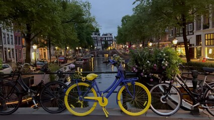 Yellow And Blue Bicycle On The Bridge At Sunset