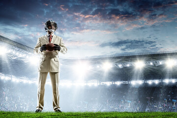 Businessman acting as american football players