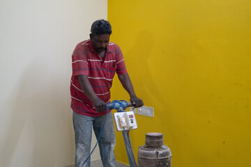 Bangalore, India 12th July 2022: Mosaic Tiles Polishing and Cleaning to remove dust and texture...
