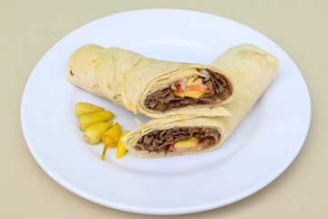 Lavash doner kebab ( doner zurna durum )  or shawarma sliced in plate isolated. 