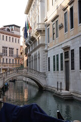 Fototapeta na wymiar Gondolers in Venice Canals Italy Beautiful old architecture reflections high resolution 