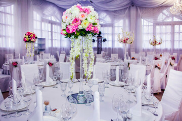 Flower arrangement at a wedding banquet in a restaurant in neon colors