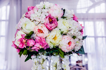 Flower arrangement at a wedding banquet in a restaurant in neon colors
