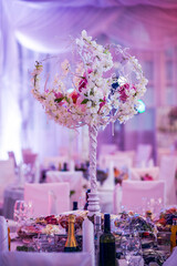 Flower arrangement at a wedding banquet in a restaurant in neon colors