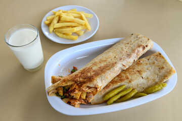 Lavash doner kebab ( doner zurna durum )  or shawarma sliced in plate isolated. 