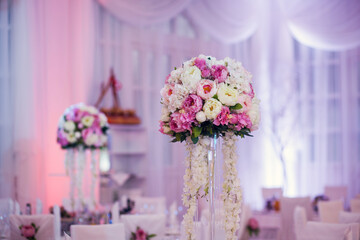 Flower arrangement at a wedding banquet in a restaurant in neon colors