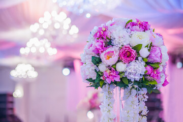 Flower arrangement at a wedding banquet in a restaurant in neon colors