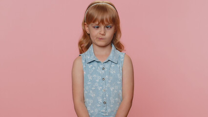 Funny amusing preteen child girl kid making playful silly facial expressions and grimacing, fooling around, looking awkward with crossed eyes. Little toddler children stupid brainless dumb expression