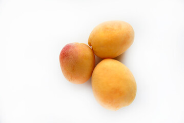 Yellow juicy fresh plum on a white background. Juicy yellow sweet fruits.