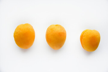 Yellow juicy fresh plum on a white background. Juicy yellow sweet fruits.