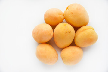 Yellow juicy fresh plum on a white background. Juicy yellow sweet fruits.