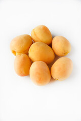 Yellow juicy fresh plum on a white background. Juicy yellow sweet fruits.