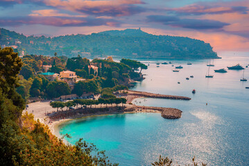 Aerial view of Cote d'Azur known as the French Riviera  coastline illuminated at sunset, in France