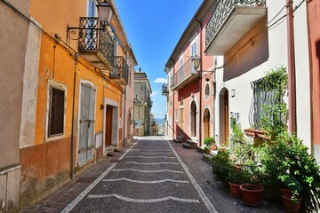 A narrow street among the old houses of Greci, a village in the Campania region, Italy.