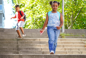multiethnic kids with backpacks on the way to school. Back to school concept