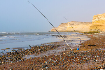 The sea,two fisher rods in laayoune city