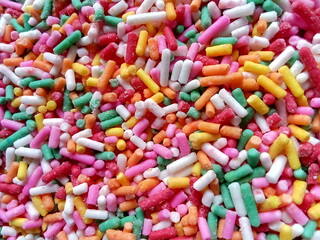 Colorful and chocolate candy sprinkles. Nonpareils, rainbow sprinkle