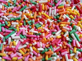 Colorful and chocolate candy sprinkles. Nonpareils, rainbow sprinkle
