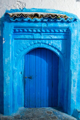 A blue door in the blue city Chefchaouen by night