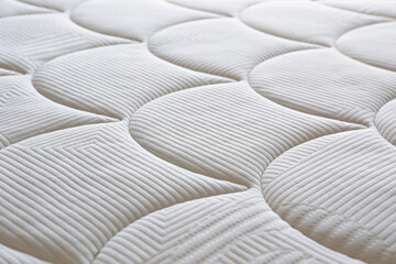 Close up shot of white orthopedic mattress top side surface pattern with a lot of copy space for...