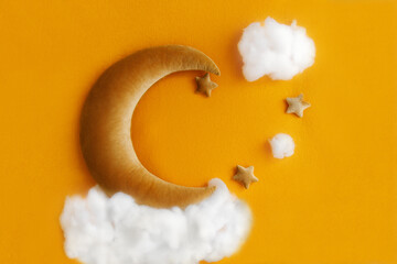 Shoot set up with moon, stars and clouds for newborn on the ginger background. Photo zone for a photo session of newborns. Setup ready for newborn photo shoot and baby photography.