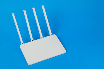 White wifi router on blue background